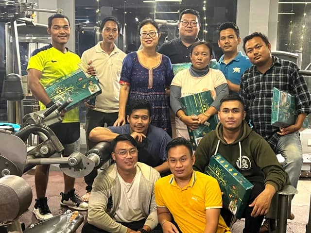 Members beside the machines on the Altius floor