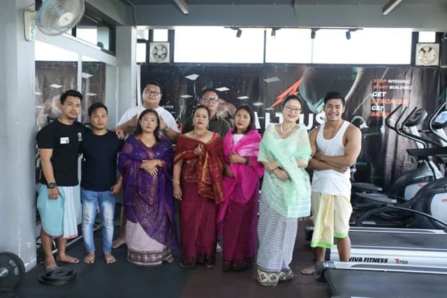 Members and families gathered on the gym floor